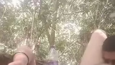 Mistress lets her servant lick her pussy during outdoor sex