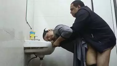 Wife in abroad fucked by office manager in washroom